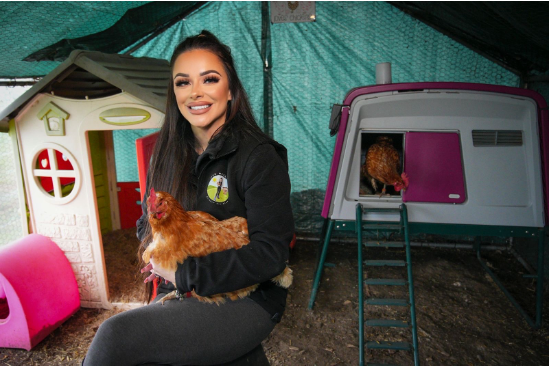 Omlet meets: Kat hen hotelier extraordinaire with chicken and a pink eglu cube for hen hotel