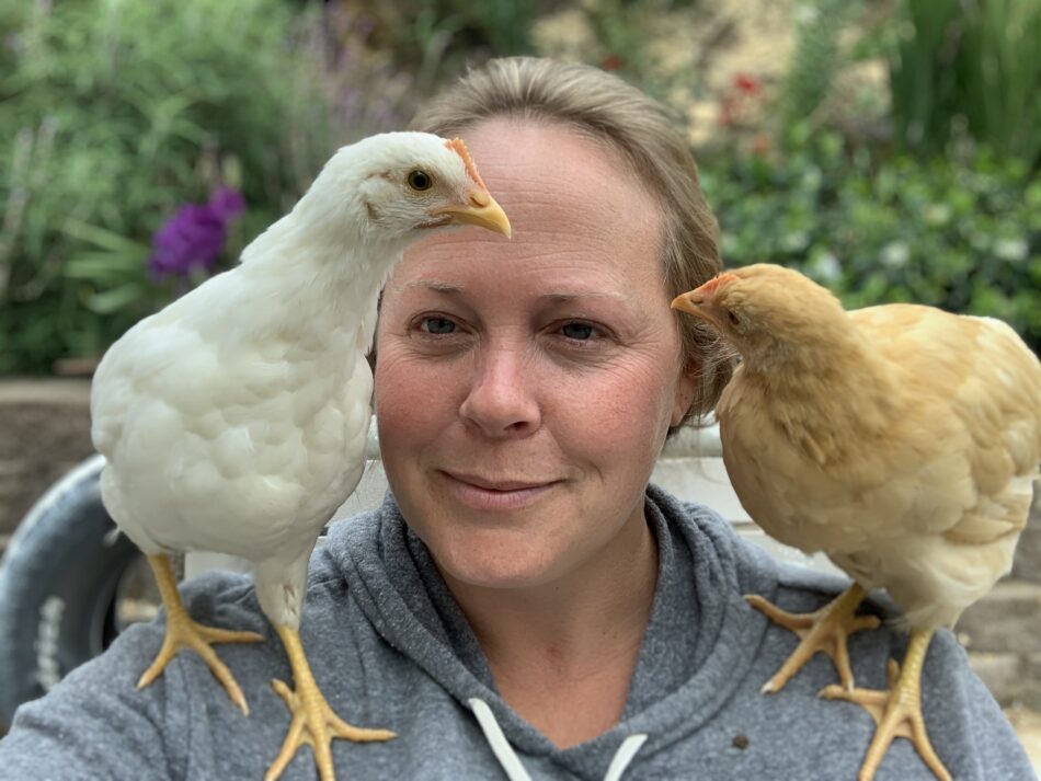 Rynell with two chickens on her shoulders